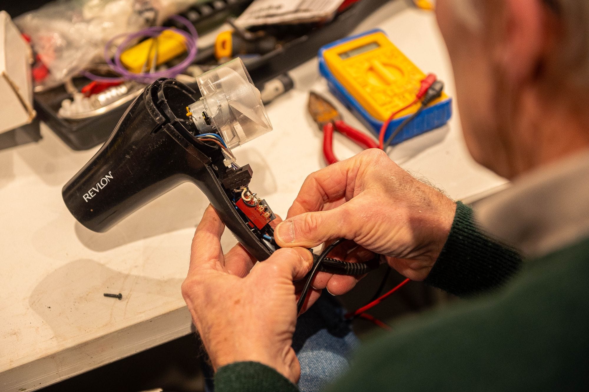 the deputy first minister of wales , huw irranca davies, visits a repair café in carmarthen